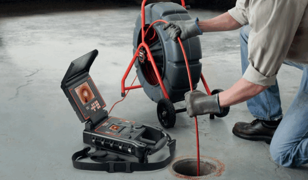 Technician performing a sewer camera inspection in Ontario
